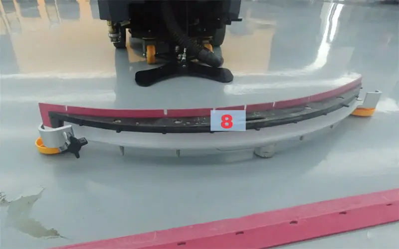 Detailed internal structure of a floor scrubber water suction unit, illustrating how to replace the squeegee blades with position 8 marked.